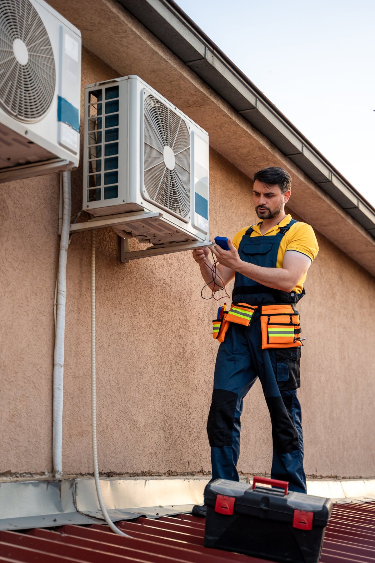 HVAC technician inspecting and maintaining air conditioning units on a rooftop, created as an independent concept for an HVAC Company website